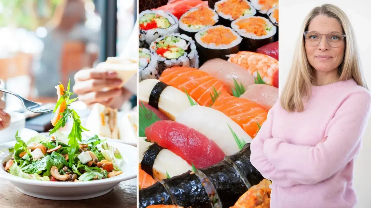 En kvinna med glasögon ler, bredvid en stor bricka med sushi och en sallad. Kanske en IBS-vänlig måltid?
