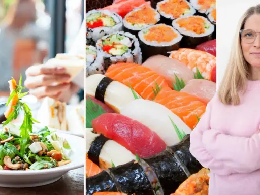 En kvinna med glasögon ler, bredvid en stor bricka med sushi och en sallad. Kanske en IBS-vänlig måltid?